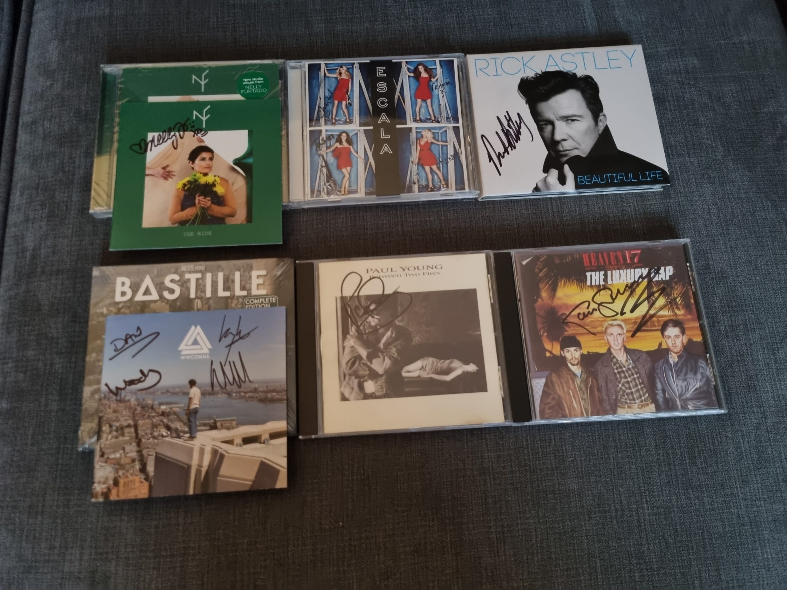 DOZENS OF SIGNED CDS – Elite Autographs